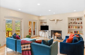 Smart TV, fireplace, books, printers