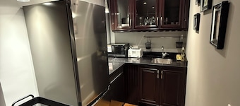 Newly furnished King-bed Room1, shared bath and common space