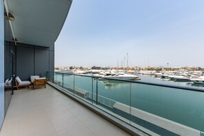 A balcony with a view of a marina.