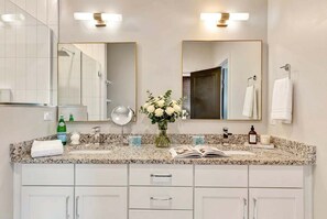 Shower, hair dryer, towels, shampoo