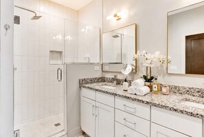 Shower, hair dryer, towels, shampoo