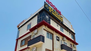 A multi-story building with a sign indicating it is a residential complex. - Jc Residence (Bangaluru)