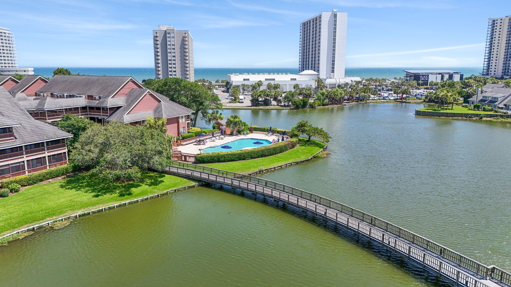Enjoy the gorgeous pool overlooking the lake with an oceanview