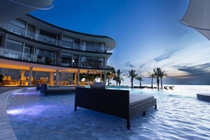 Outdoor pool, open 8:00 AM to 11:00 PM, sun loungers