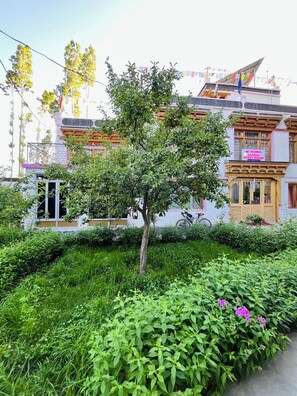 A traditional building with a sign indicating it is a guest house.