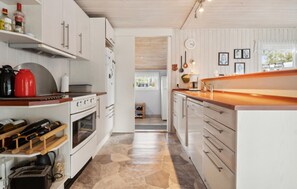 Fridge, stovetop, dishwasher, coffee/tea maker