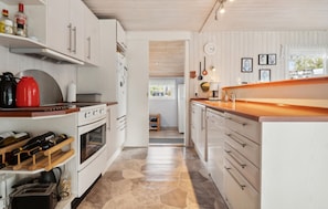 Fridge, stovetop, dishwasher, coffee/tea maker