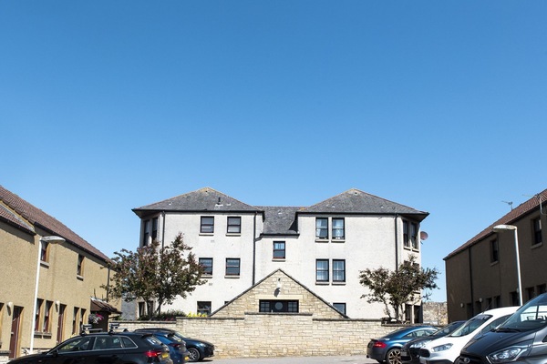 Enjoy a sunny view of this stylish property from the car park, featuring convenient parking and modern architecture