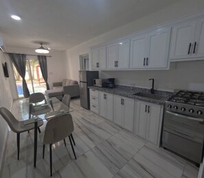 Fridge, microwave, stovetop, coffee/tea maker