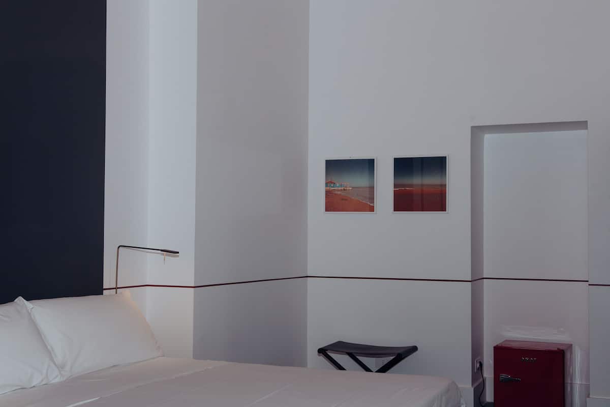 Family Quadruple Room, 1 Queen Bed with Sofa bed, Courtyard View | Free minibar items, in-room safe, desk, laptop workspace