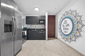 Fridge, microwave, stovetop, coffee/tea maker