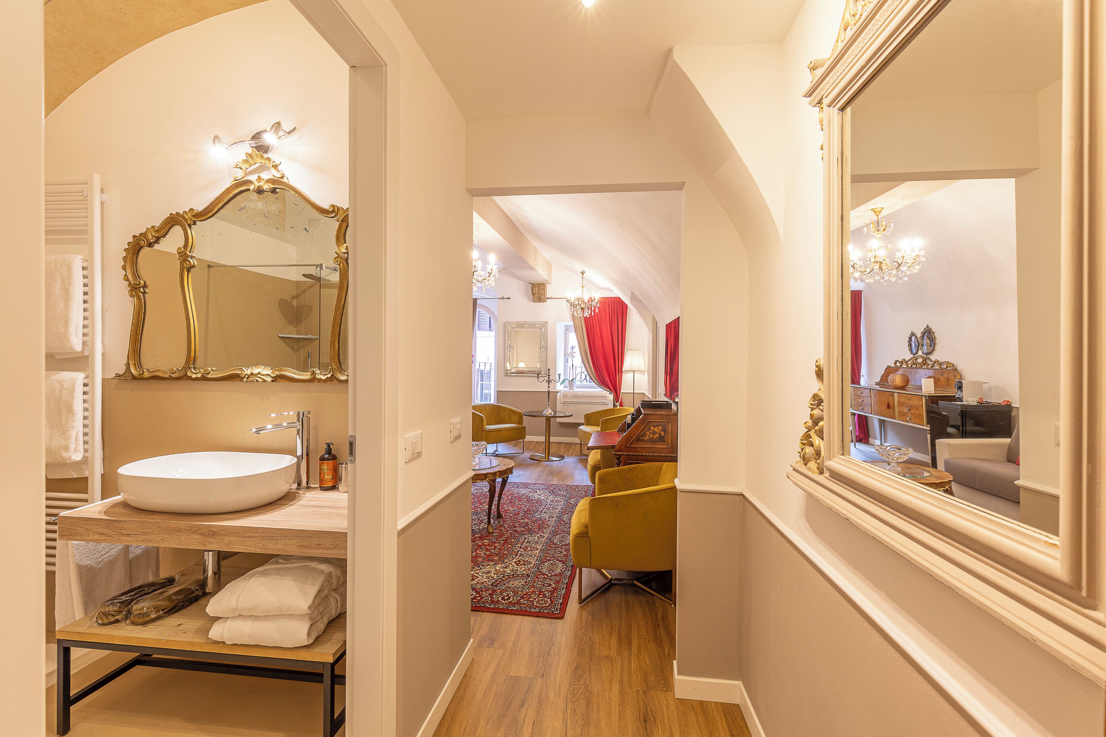A modern bathroom with a large mirror, a sink, and a vanity.