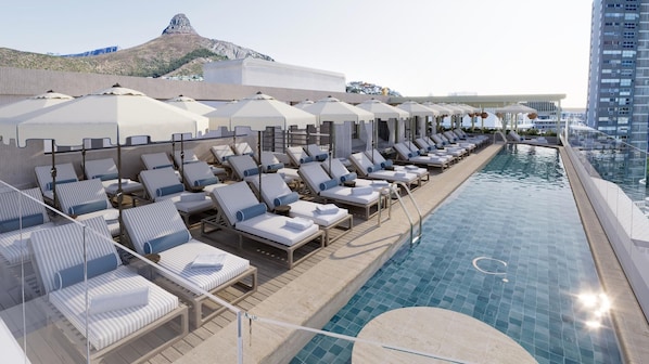 Outdoor pool, pool umbrellas, sun loungers