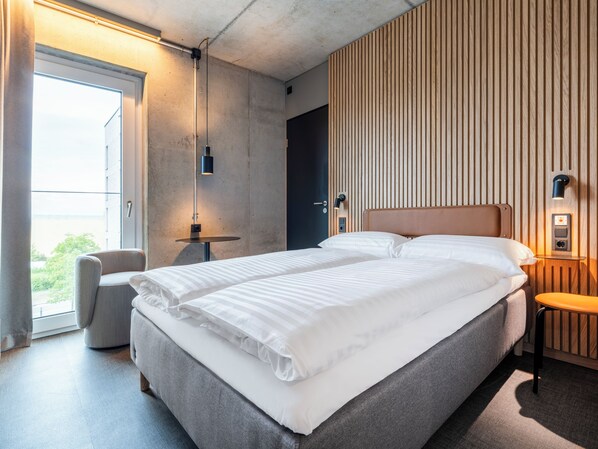 Habitación Business individual | Ropa de cama hipoalergénica, cunas gratuitas, ropa de cama