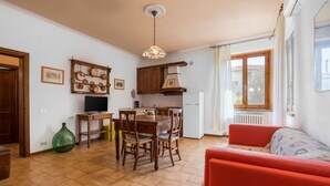 A compact living space with a dining area, kitchen, and seating area. - Stunning private villa with WIFI, A/C, private pool, TV, patio, pets allowed, close to San Gimignano (Montaione)