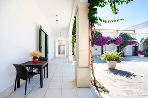 Outdoor dining - Room 'San Biagio - Deluxe 8' with Shared Pool, Wi-Fi, and Air Conditioning (Calimera)