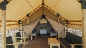 A tent with two beds, a table, and a dresser. -  Pana Unique Charyn (Charyn Canyon)