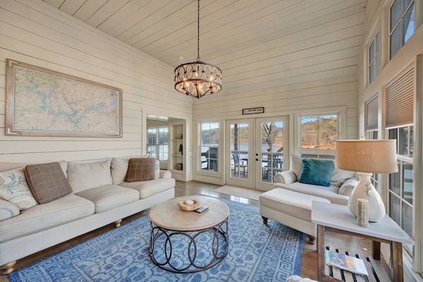 Comfortable upstairs living space with fireplace and views to the lake.