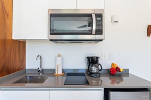 Fridge, microwave, stovetop, coffee/tea maker