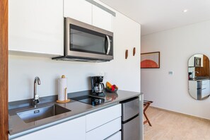 Fridge, microwave, stovetop, coffee/tea maker