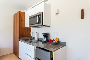 Fridge, microwave, stovetop, coffee/tea maker