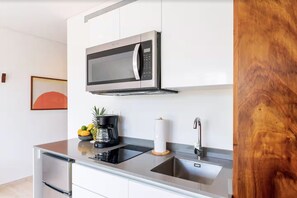 Fridge, microwave, stovetop, coffee/tea maker