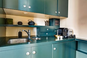 Fridge, microwave, stovetop, coffee/tea maker