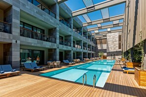 2 outdoor pools, pool umbrellas, pool loungers