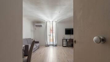 Studio | Living area | 30-inch TV with satellite channels