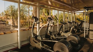A gym with treadmills, elliptical machines, and weight equipment. - Maspalomas Villas by Dunas - Only Adults (San Bartolome de Tirajana)