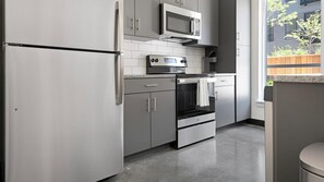 Fridge, dining tables - Landing | Chic 1BD, Clubhouse, Gym (St. Louis)