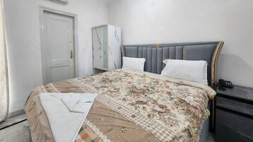 Deluxe Double Room, City View | Desk, laptop workspace, WiFi (free), bed sheets