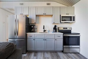 Fridge, microwave, stovetop, coffee/tea maker