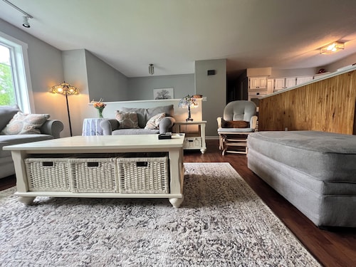 Spacious five-bedroom home off Back Lake with direct trail access on Spooner Rd