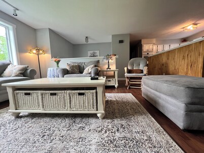 Spacious five-bedroom home off Back Lake with direct trail access on Spooner Rd