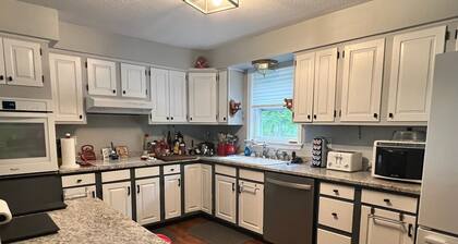 Spacious five-bedroom home off Back Lake with direct trail access on Spooner Rd