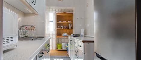 Fridge, microwave, stovetop, coffee/tea maker