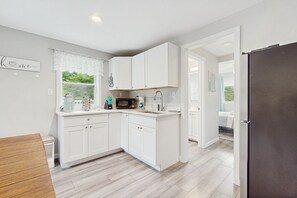 Fridge, microwave, coffee/tea maker, toaster