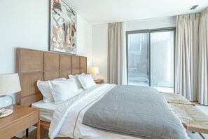 Premium bedding, desk, laptop workspace, blackout curtains