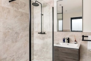 Shower, hair dryer, towels