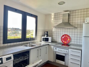 Microwave, dishwasher, coffee/tea maker, cookware/dishes/utensils