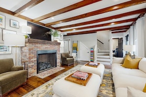 TV, fireplace, books