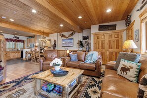 A cozy living room with wooden furniture, a dining area, and a kitchen. - Timber Wolf Lodge | KBM Resorts | Gas Fireplace, Common Hot Tubs, Near Canyons Village | 2 Units, 5 Bedrooms | ML-1343 (Park City)