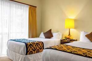 A hotel room with two beds, a nightstand with a lamp, and a window with curtains. - Honua Kai | Ocean View 4 BR, Sleeps 14 | Car Incl. w/ 6+ Nights | HKH ML-1351 by KBM (Lahaina)