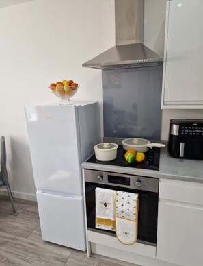 Fridge, microwave, oven, cookware/dishes/utensils