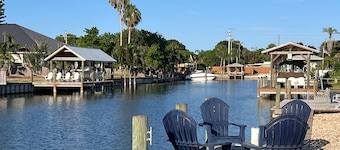 Spacious waterfront home with private pool, sunroom and dock.