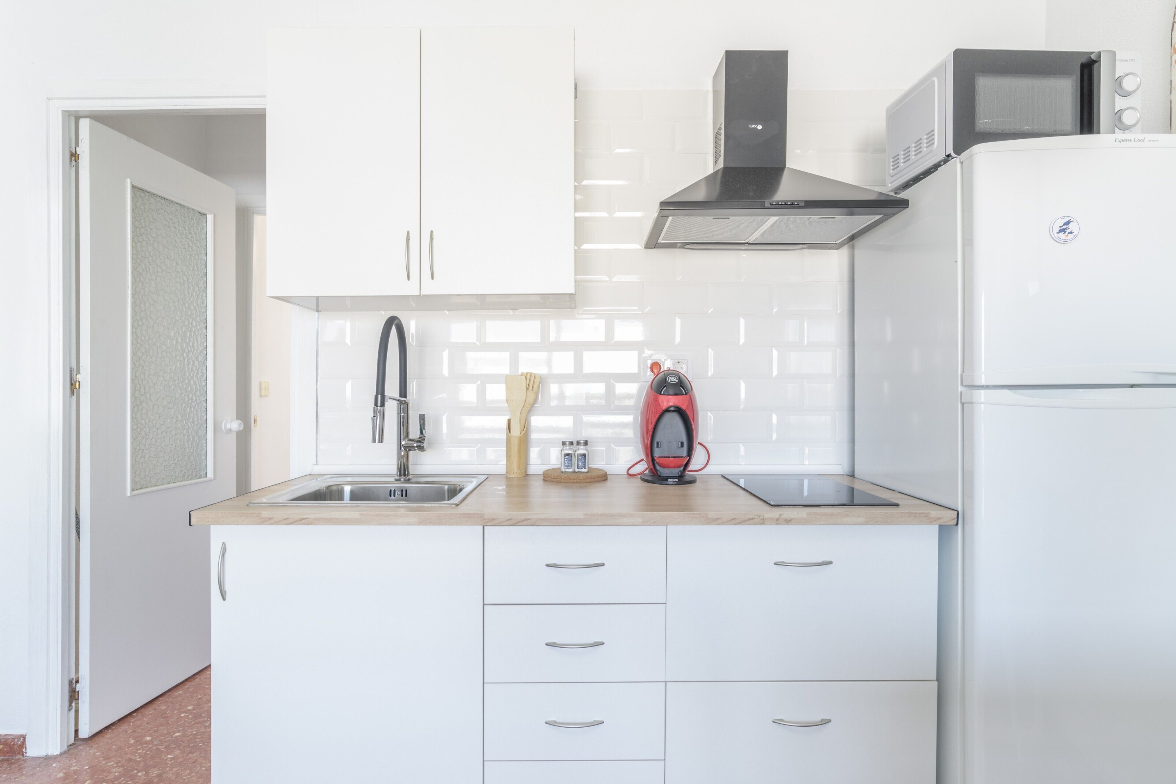 Fridge, microwave, stovetop, coffee/tea maker