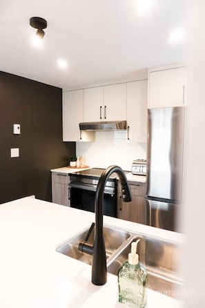 Fridge, microwave, oven, dining tables
