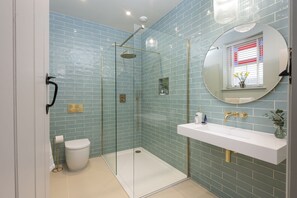 Shower, hair dryer, towels, toilet paper