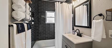 Shower, hair dryer, towels, soap